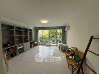 Spacious living room with garden view and modern furnishings