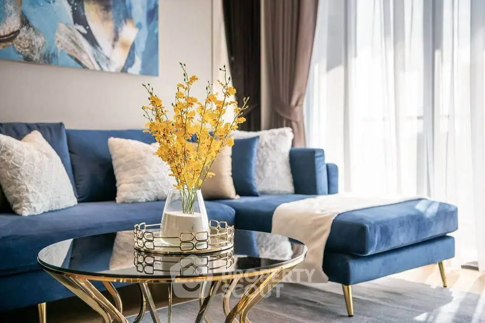 Luxurious living room with elegant blue sofa and stylish decor