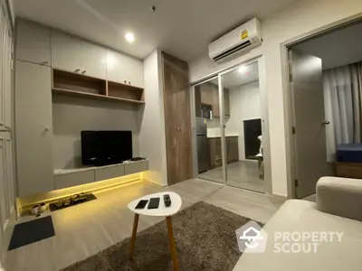 Modern living room with sleek design and cozy ambiance, featuring built-in storage and stylish decor.