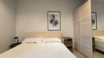 Modern bedroom with stylish decor and ample storage space