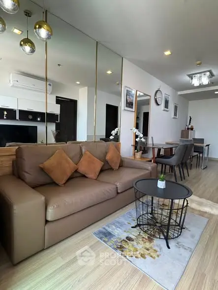 Modern living room with stylish decor and comfortable seating in a contemporary apartment.