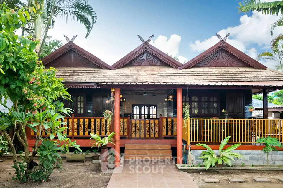 Charming traditional wooden house with lush garden and inviting entrance.