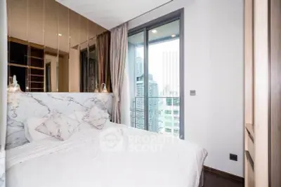 Luxurious bedroom with marble accents and city view balcony in modern apartment
