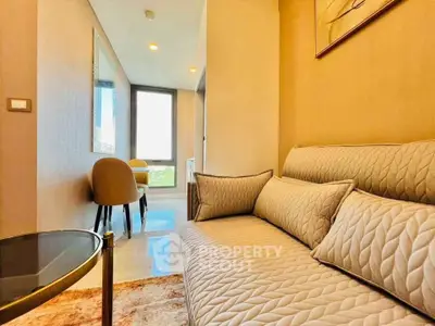 Stylish modern living room with cozy sofa and elegant dining area, perfect for urban living.