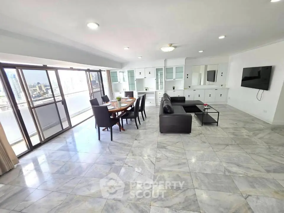 Spacious modern living room with city view and elegant furnishings