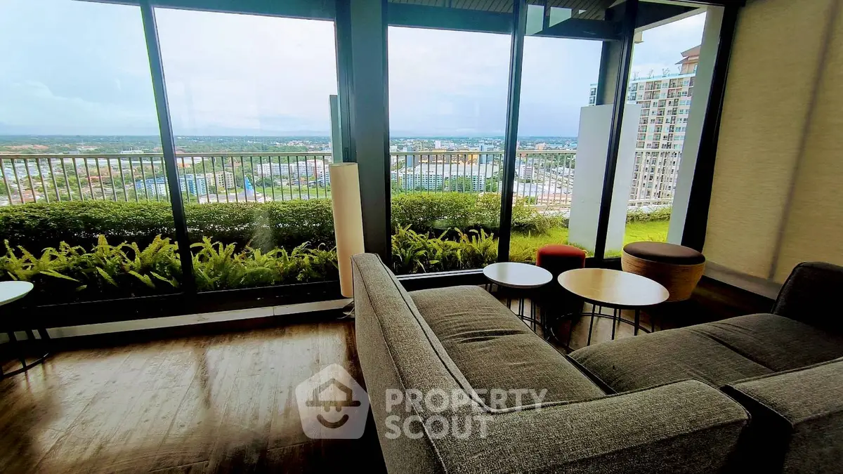 Spacious living room with panoramic city view and modern furniture