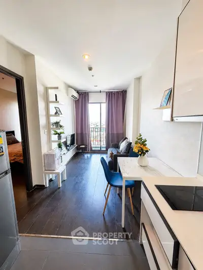 Modern apartment with open layout, stylish decor, and balcony view, perfect for urban living.