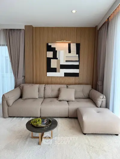 Stylish modern living room with elegant sofa and abstract art, perfect for contemporary urban living.