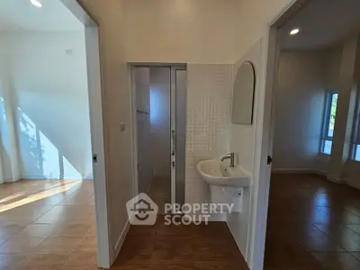 Spacious interior with modern bathroom and natural light, ideal for comfortable living.