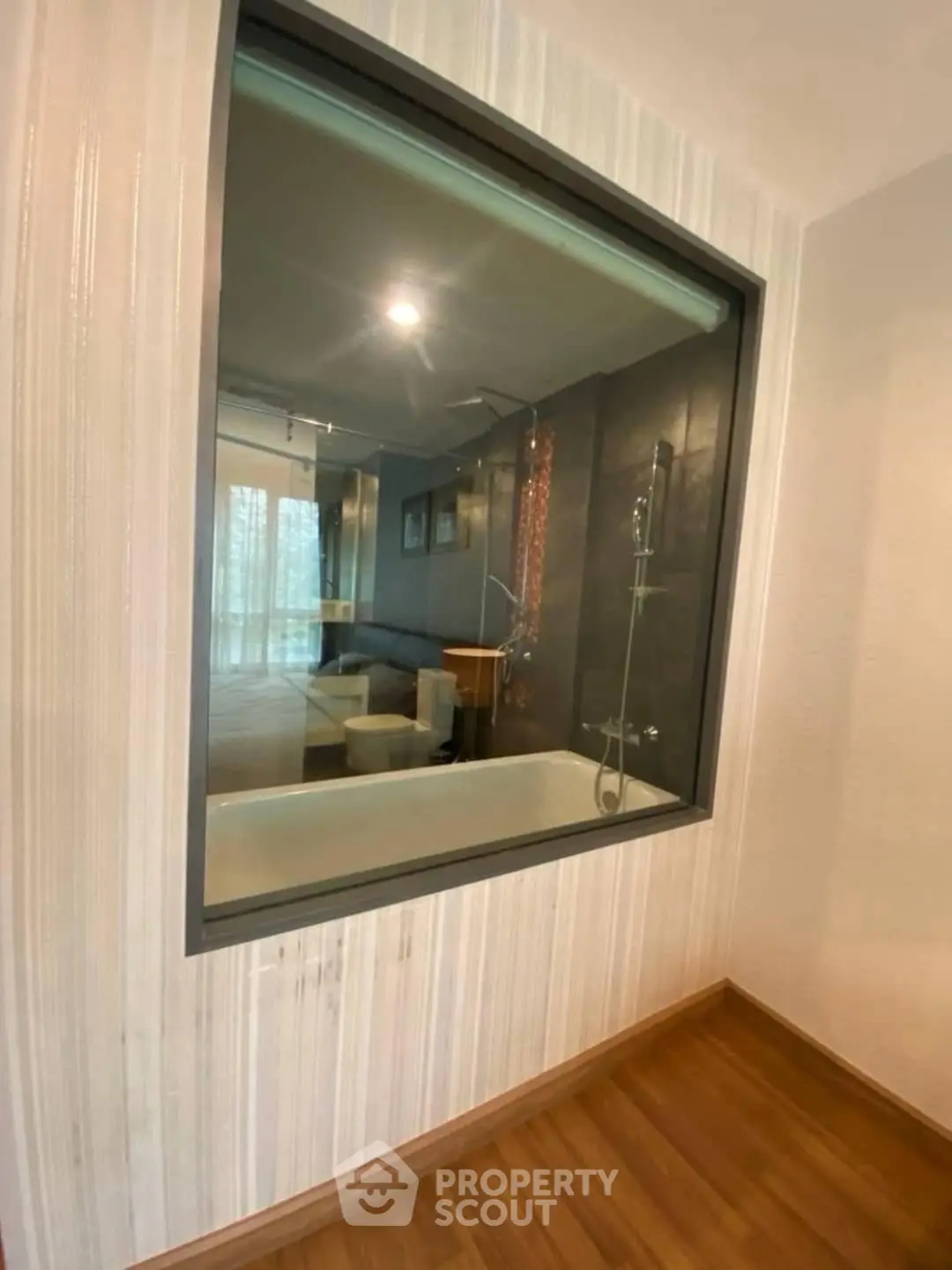 Modern bathroom with glass partition and elegant shower design