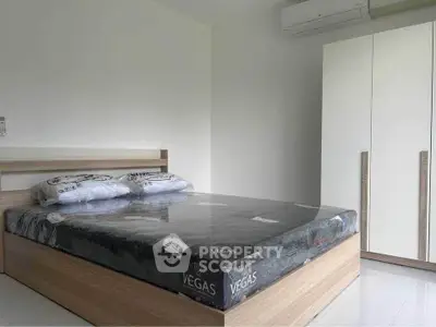 Modern bedroom with minimalist design and air conditioning