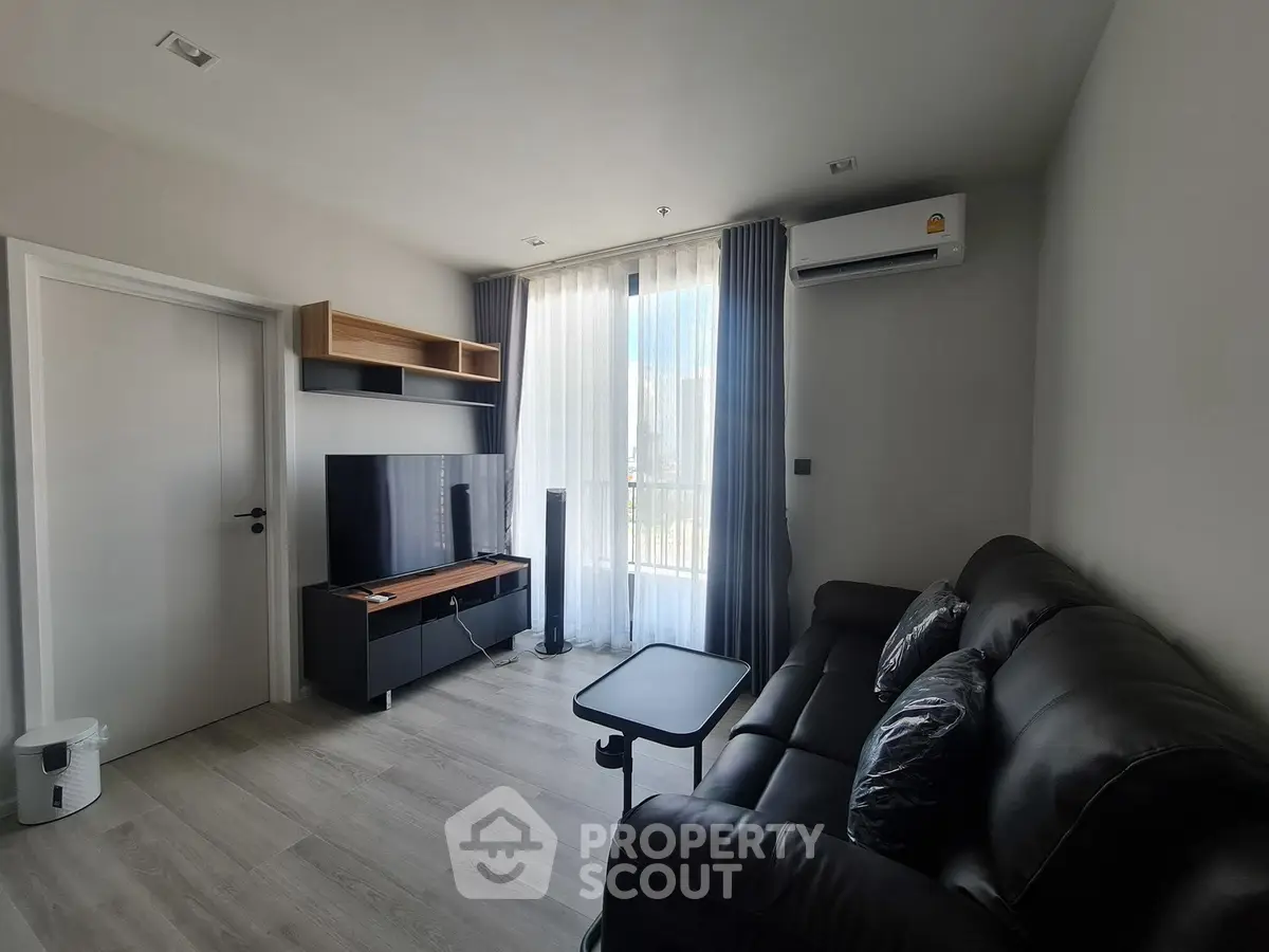 Modern living room with sleek furniture and natural light