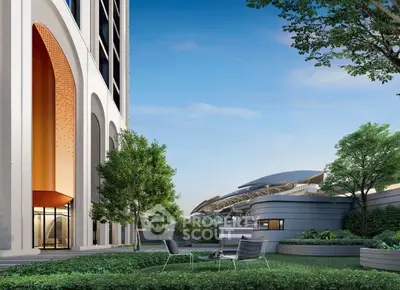 Luxurious modern building with lush garden and stunning architectural design.
