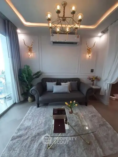 Luxurious living room with elegant chandelier and modern decor