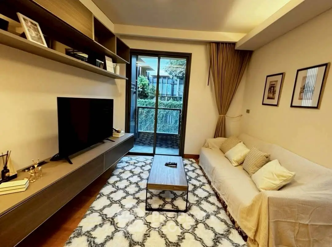 Stylish living room with modern decor and balcony view, perfect for urban living.