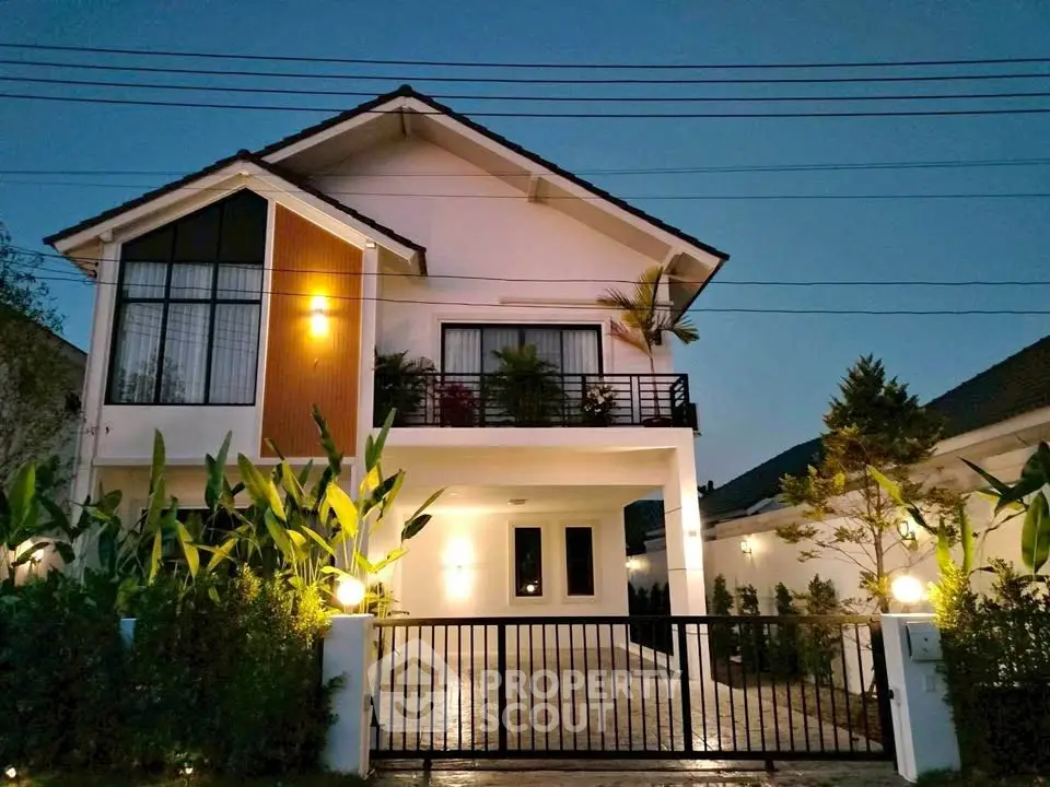 Charming two-story house with modern design and lush garden, perfect for family living.