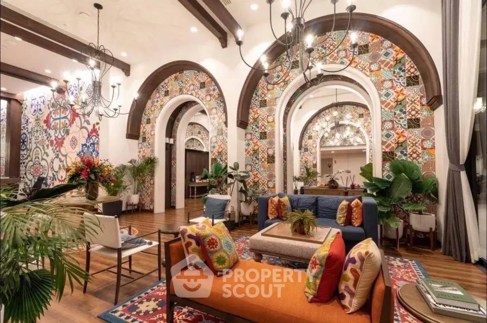 Luxurious living room with vibrant decor and elegant chandeliers in a spacious open layout.