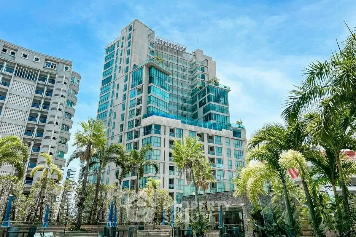 Luxurious high-rise building with lush greenery and modern architecture