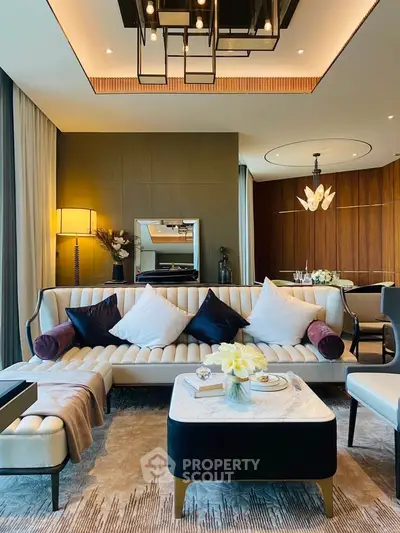 Luxurious living room with elegant decor, plush seating, and ambient lighting in a modern apartment.