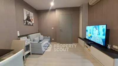 Modern living room with stylish decor and wall-mounted TV