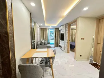 Modern open-plan living and dining area with stylish decor and natural light.