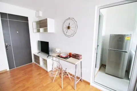 Modern apartment interior with stylish decor and compact kitchen area.