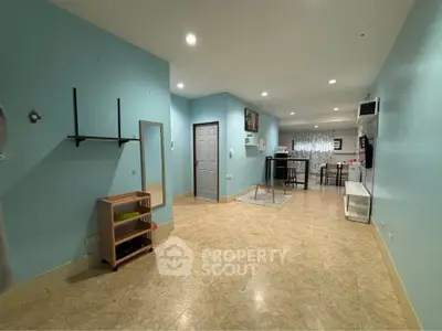 Spacious open-plan living area with modern decor and ample natural light.