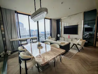 Luxurious modern living room with panoramic city views and elegant furnishings.