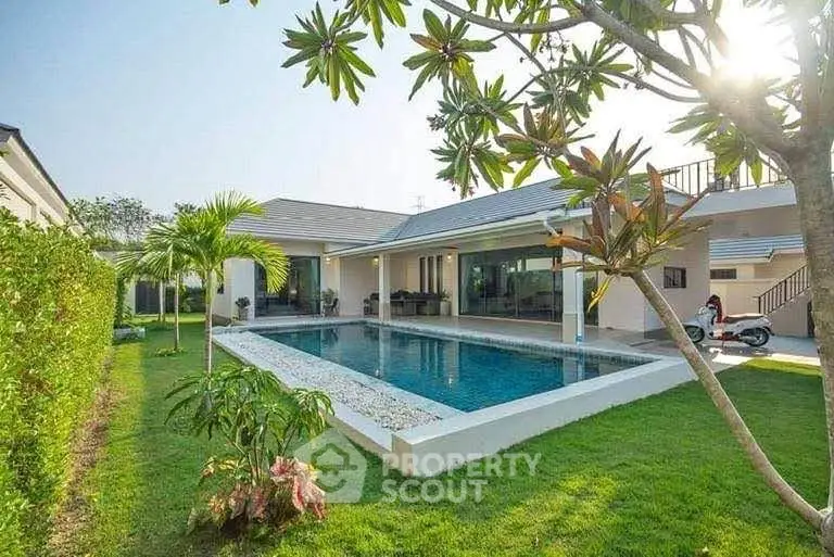Luxurious modern villa with private pool and lush garden, perfect for serene living.