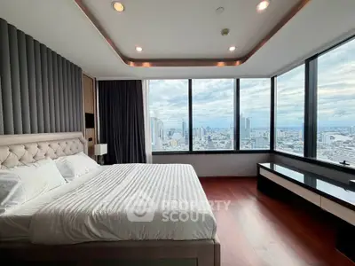 Luxurious bedroom with panoramic city views and elegant decor