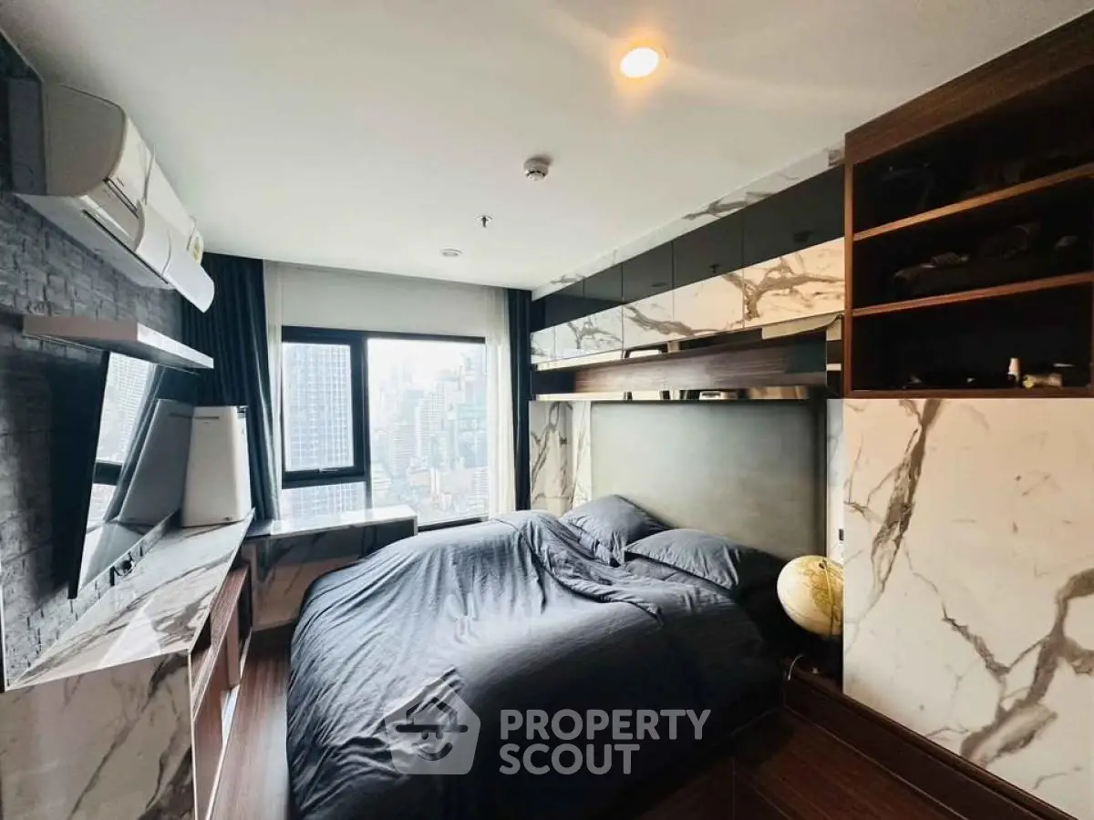 Luxurious modern bedroom with city view and elegant marble accents.