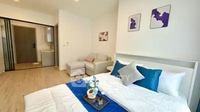 Modern bedroom with stylish decor and cozy seating area