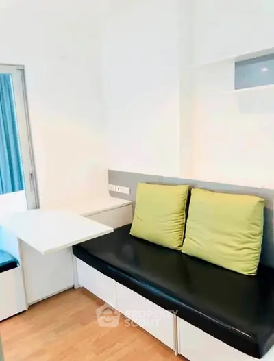 Modern compact living room with built-in seating and sleek design