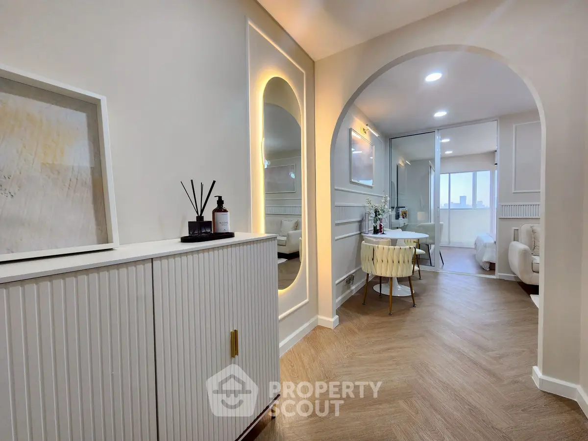 Elegant modern apartment interior with stylish decor and open layout, featuring a cozy dining area and inviting living space.