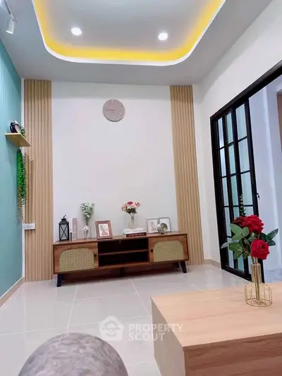 Modern living room with stylish decor and elegant lighting