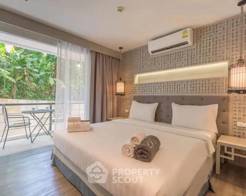 Luxurious bedroom with balcony view and modern decor