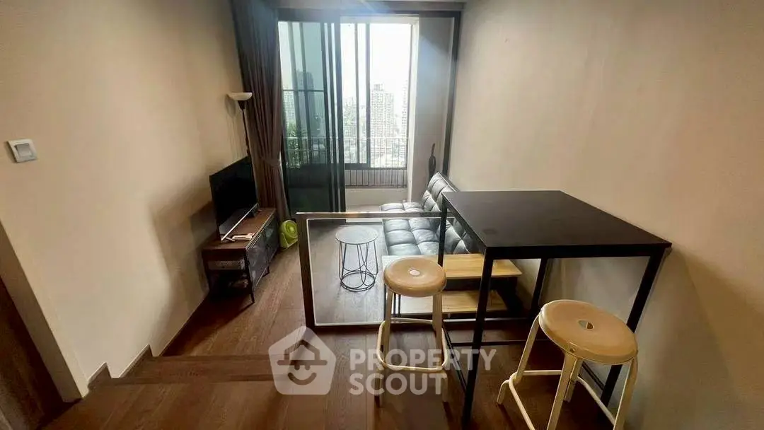 Modern compact living room with city view and stylish furniture