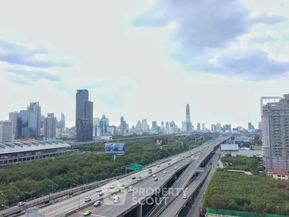 Stunning cityscape view with modern skyscrapers and highway, perfect for urban living enthusiasts.