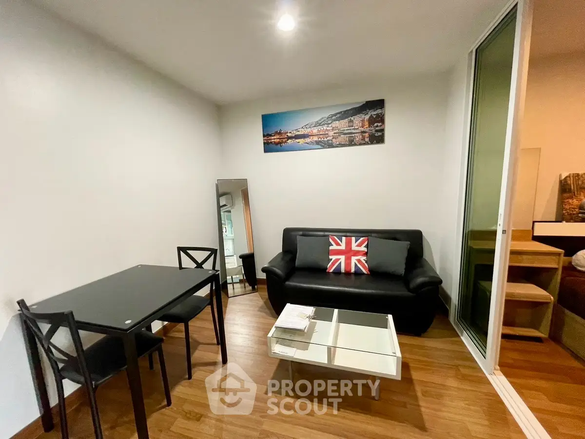 Modern living room with sleek furniture and stylish decor in a cozy apartment setting.