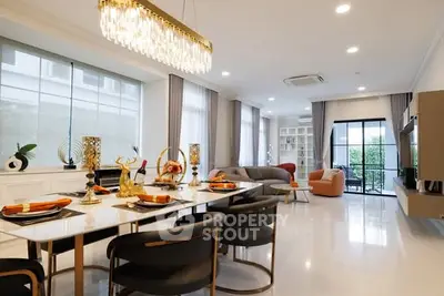 Luxurious open-plan living room with elegant dining area and modern decor