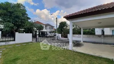 Spacious residential property with large driveway and lush green lawn