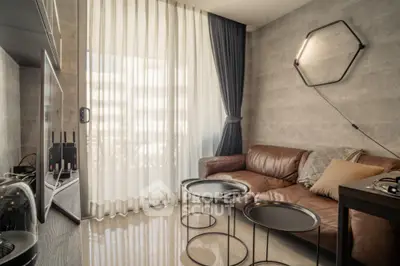 Modern living room with leather sofa and stylish lighting, featuring floor-to-ceiling windows and elegant decor.