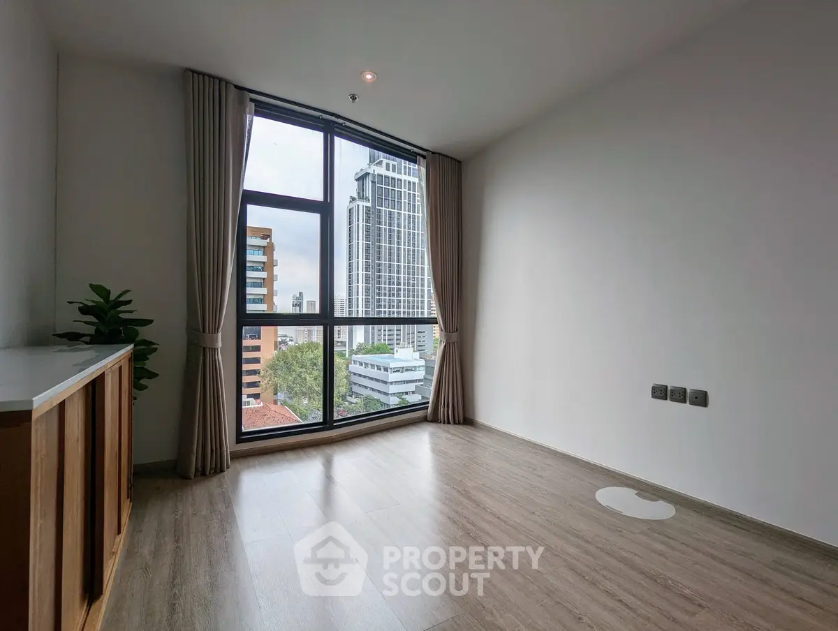Spacious corner unit with large windows offering stunning city views, perfect for modern living.