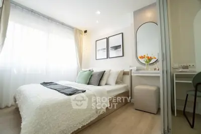 Modern bedroom with stylish decor and natural light