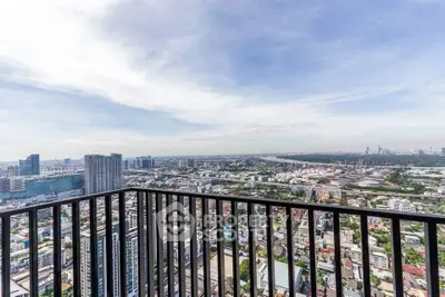 Stunning high-rise balcony view overlooking cityscape with expansive skyline.
