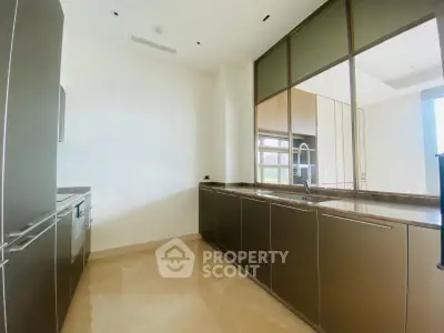 Luxurious modern kitchen with sleek cabinetry and marble countertops