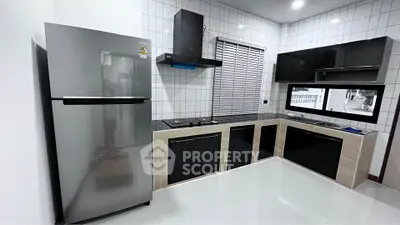 Modern kitchen with sleek appliances and open layout design