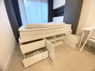 Modern bedroom with storage bed and sleek design, perfect for maximizing space in urban living.