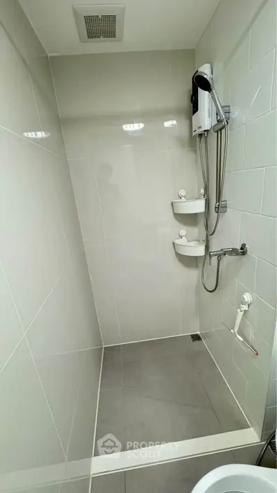 Modern bathroom with sleek shower fixtures and minimalist design