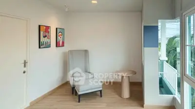 Bright corner unit with modern decor and large windows offering natural light.